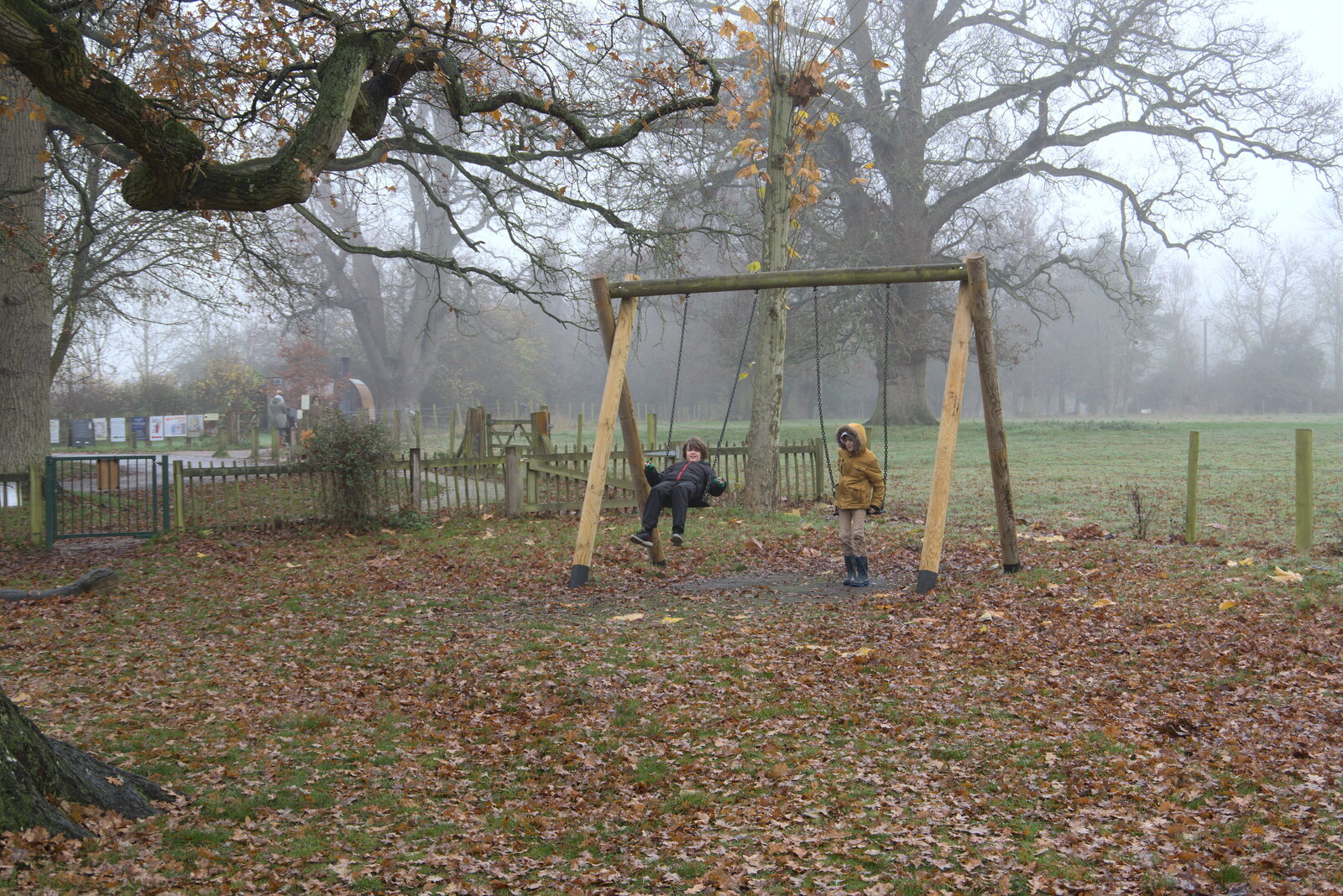 The boys have a swing from A Return to Thornham Walks, Thornham, Suffolk - 19th December 2021