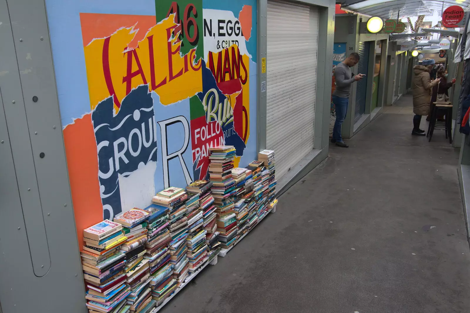 A pile of books by a stall in the market, from Scooters and a Bit of Christmas Shopping, Eye and Norwich, Norfolk - 23rd December 2021