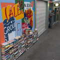 2021 A pile of books by a stall in the market