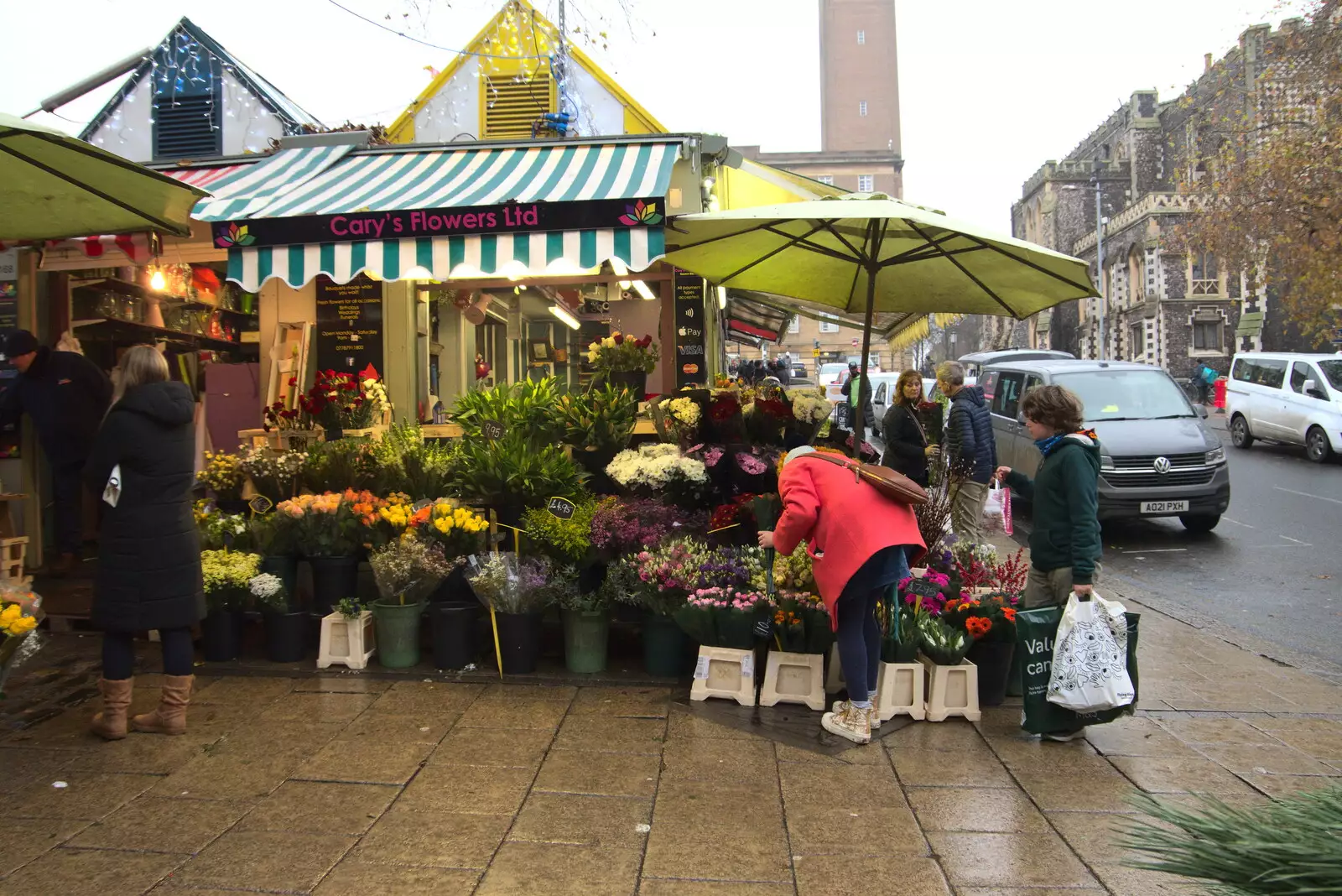 Isobel picks out some flowers, from Scooters and a Bit of Christmas Shopping, Eye and Norwich, Norfolk - 23rd December 2021