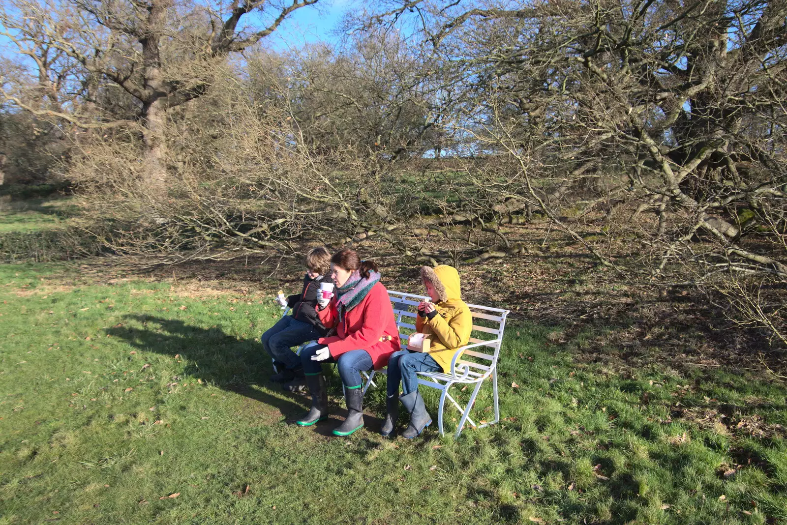 We eat a snack on the bench by the lake, from A Visit to Blickling Hall, Aylsham, Norfolk - 9th January 2022