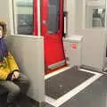 Harry sits by the train door, A Trip to the Natural History Museum, Kensington, London - 15th January 2022