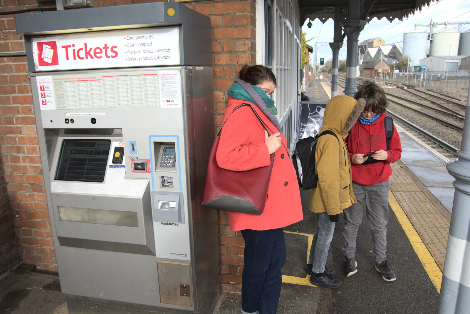 A Trip to the Odeon Cinema, Riverside, Norwich - 29th January 2022: Isobel lurks by the ticket machine on platform 2