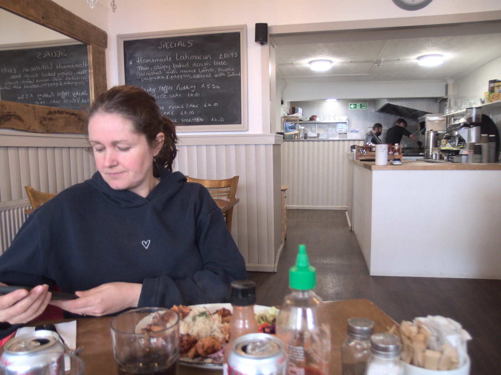 Isobel checks her phone from The Swan Inn: An Epilogue, Brome, Suffolk - 17th February 2022