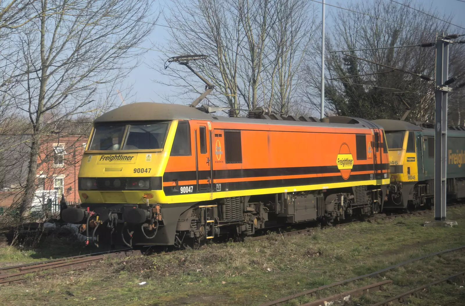 An old Class 90 - 90047 - at Ipswich, from Genesis at the O2, North Greenwich, London - 24th March 2022