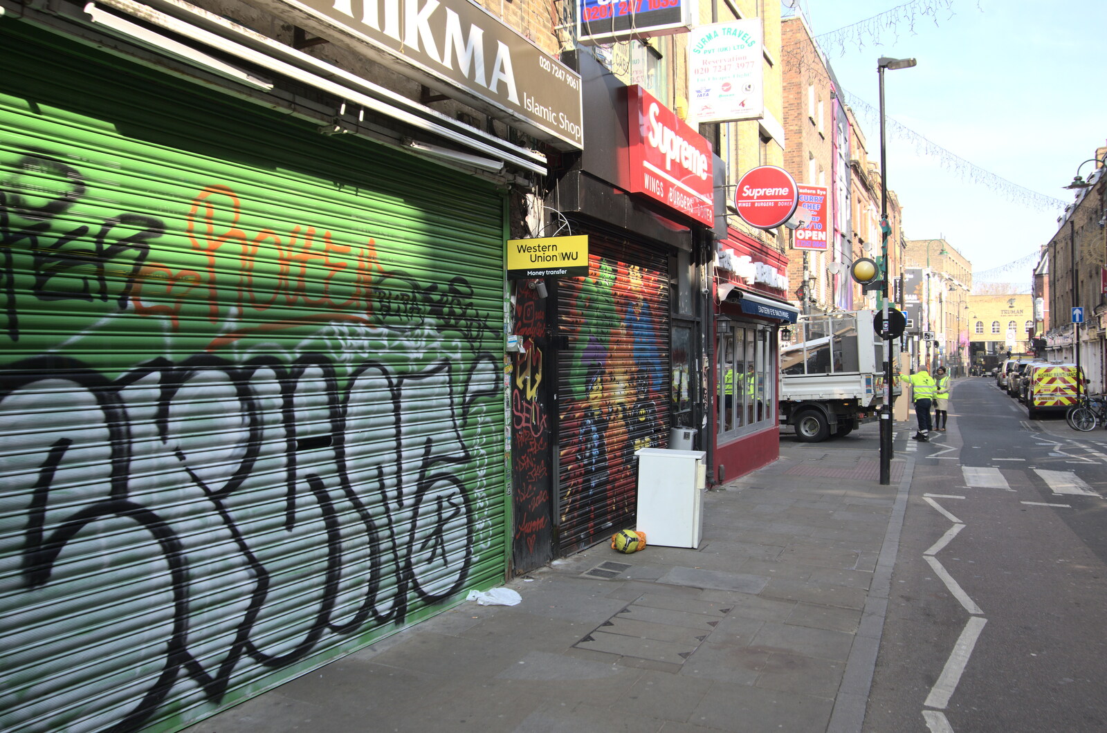 A Walk Around the South Bank, London - 25th March 2022: Shop-shutter graffiti