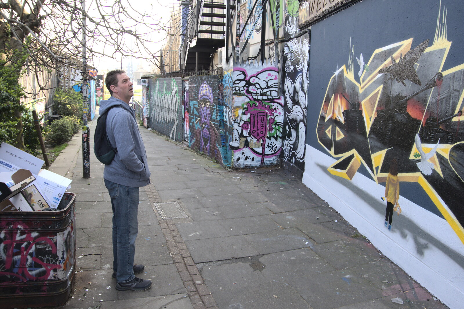 A Walk Around the South Bank, London - 25th March 2022: Sean looks up at some wall art