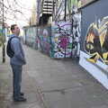 2022 Sean looks up at some wall art