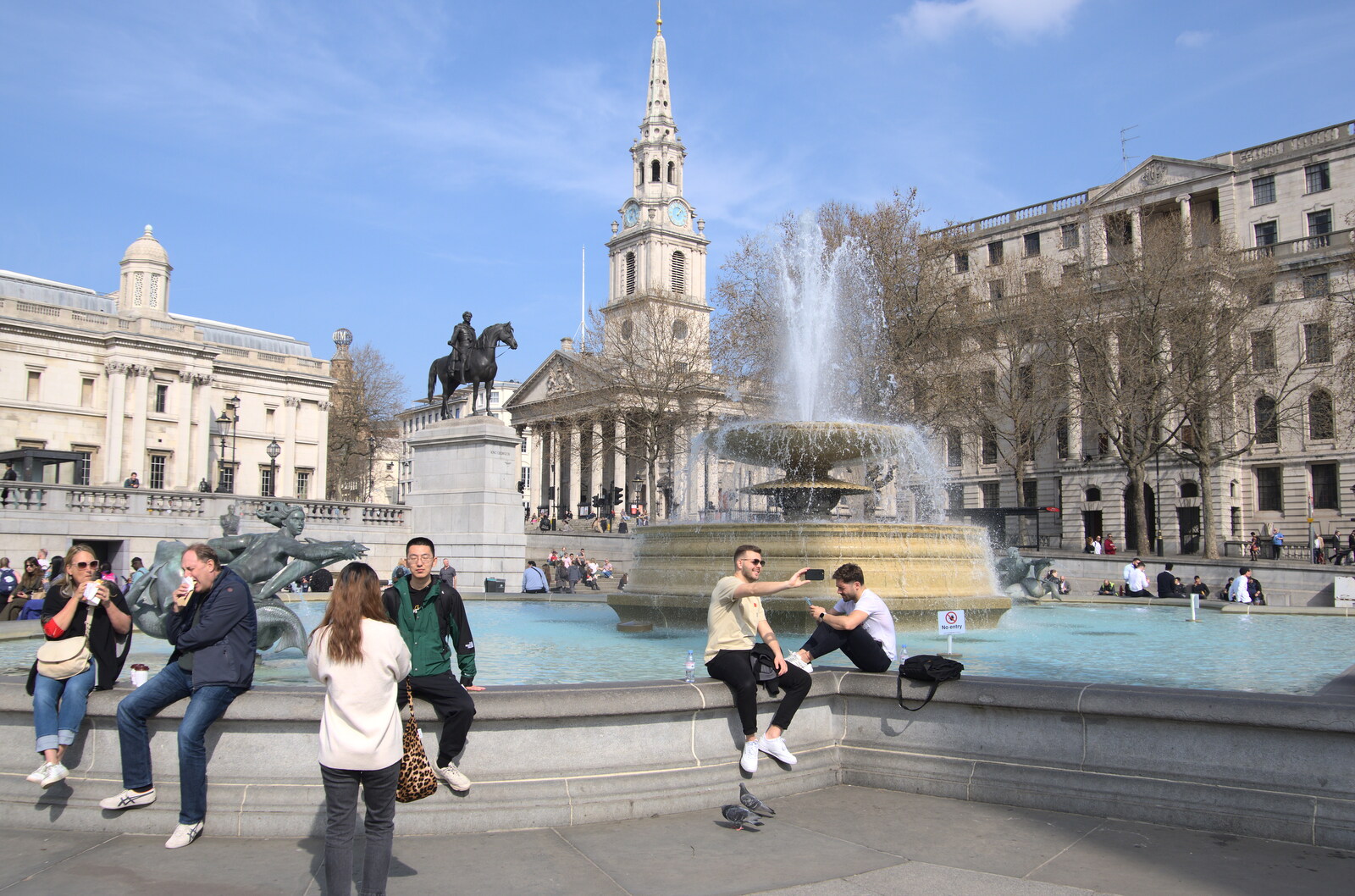 A Walk Around the South Bank, London - 25th March 2022: Tourists gets some selfies in at Trafalgar Square