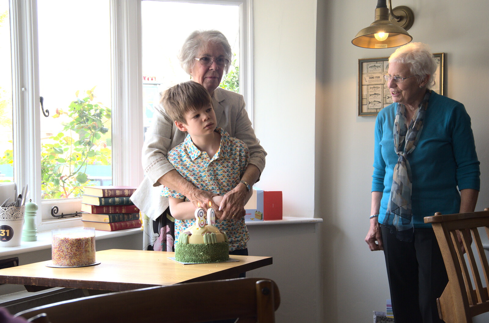 Bernice's Birthday and Walks Around New Milton and Lymington, Hampshire - 10th April 2022: Ollie helps cut the birthday cake