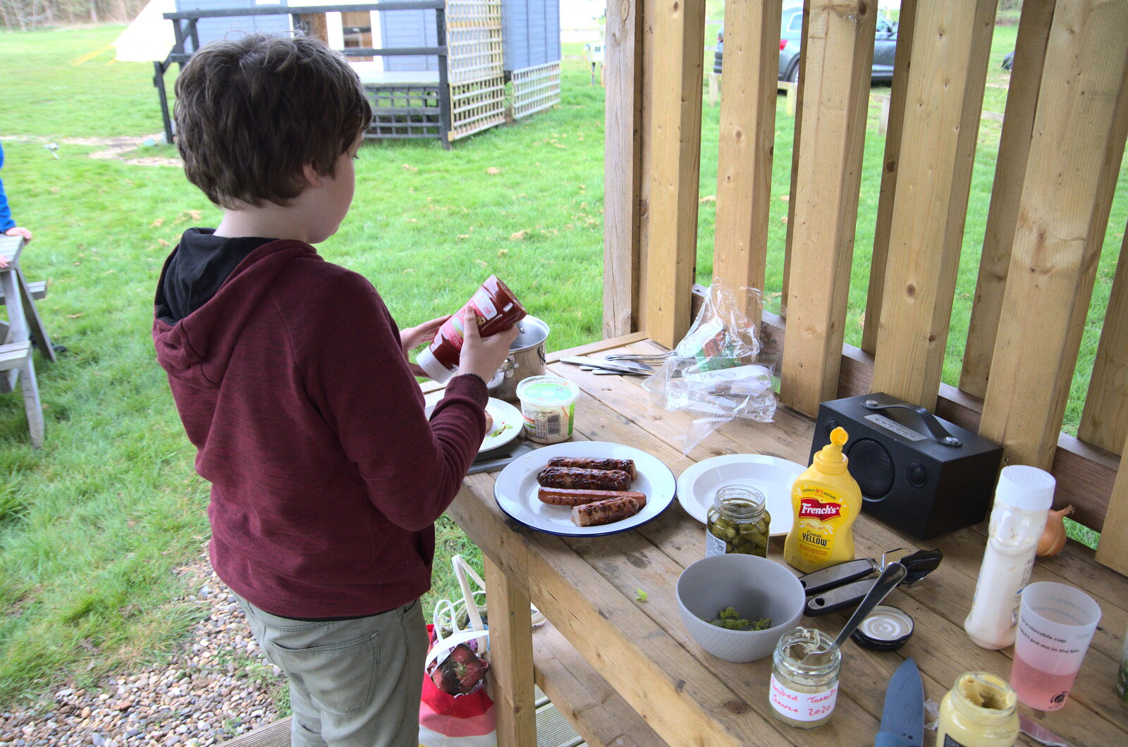A Camper-Van Trip, West Harling, Norfolk - 13th April 2022: Fred sorts out a hotdog