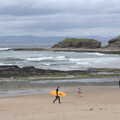 A surfer on Bundoran beach, Manorhamilton and Bundoran, Leitrim and Donegal, Ireland - 16th April 2022