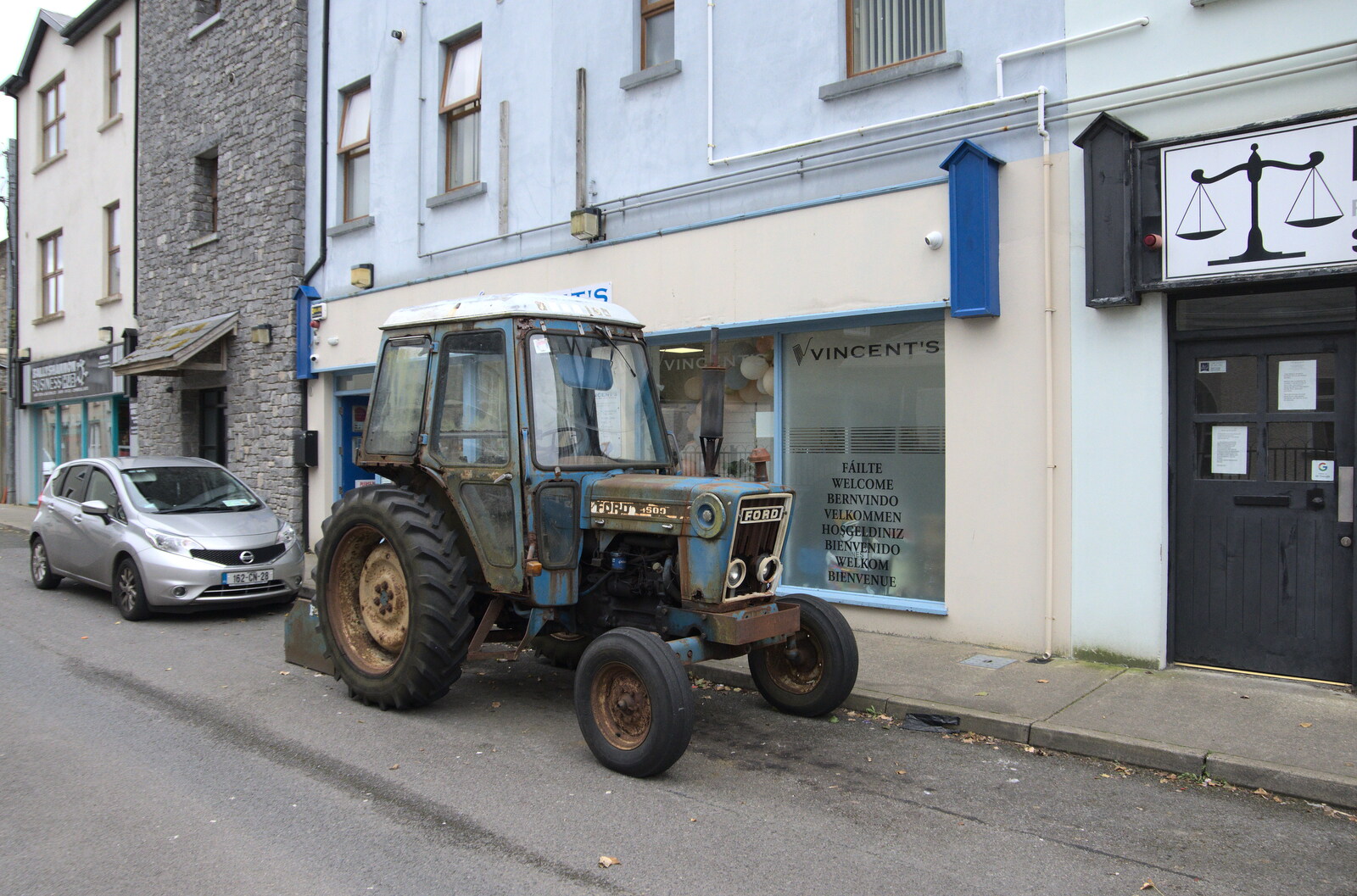 There's an ancient tractor parked on the street from Manorhamilton and Bundoran, Leitrim and Donegal, Ireland - 16th April 2022