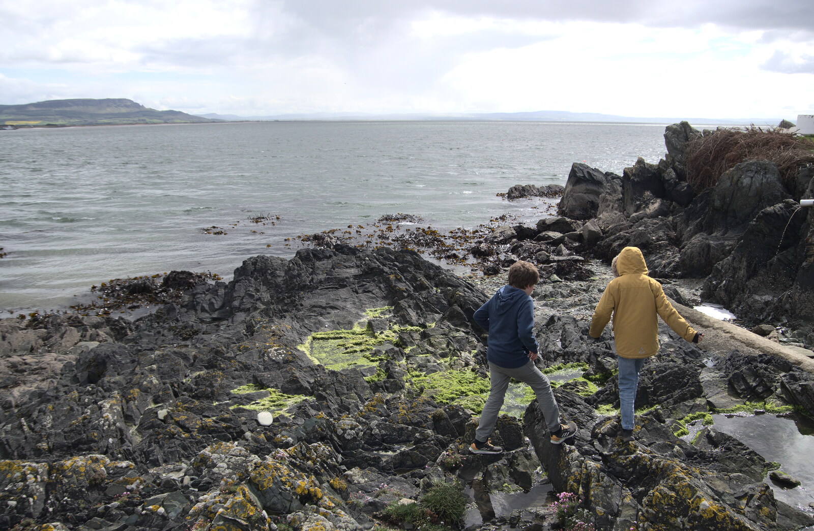 Greencastle, Doagh and Malin Head, County Donegal, Ireland - 19th April 2022: The boys explore the rocks
