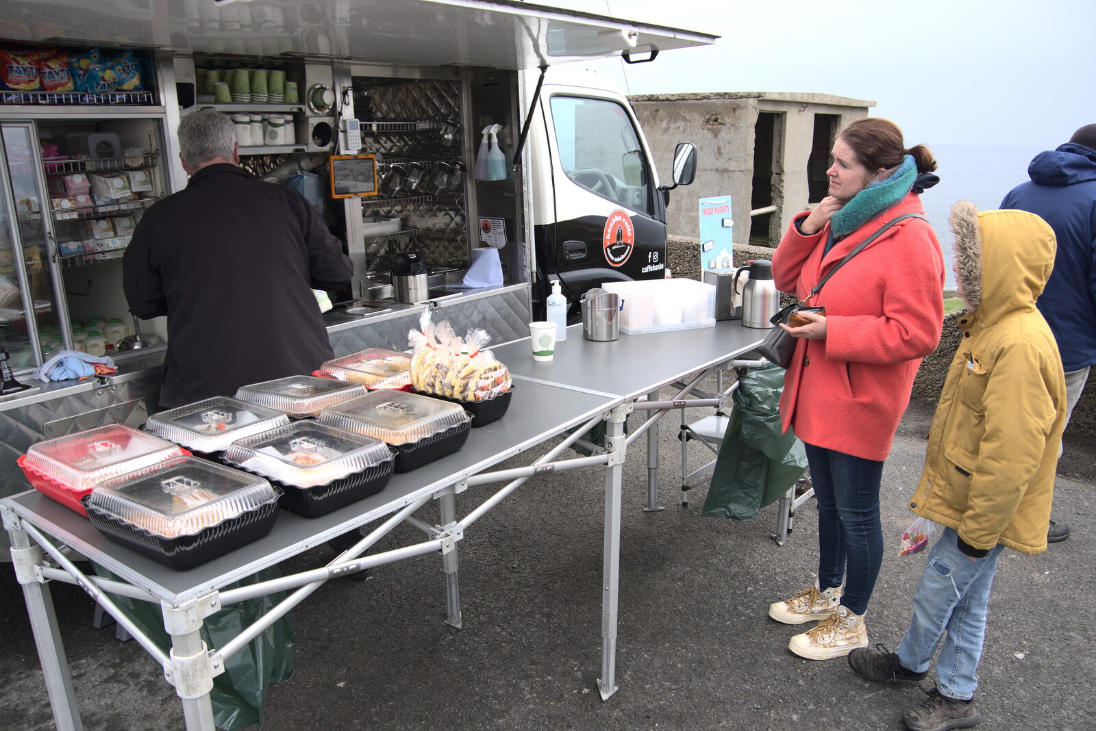 Greencastle, Doagh and Malin Head, County Donegal, Ireland - 19th April 2022: Isobel gets a coffee from the van