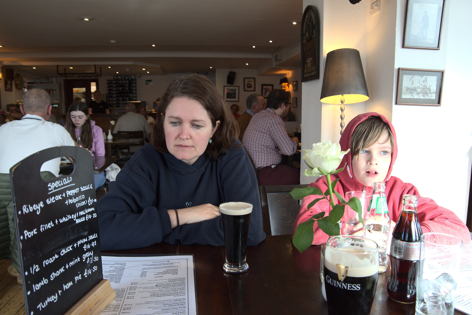 Greencastle, Doagh and Malin Head, County Donegal, Ireland - 19th April 2022: Isobel scopes the menu in the Point Bar