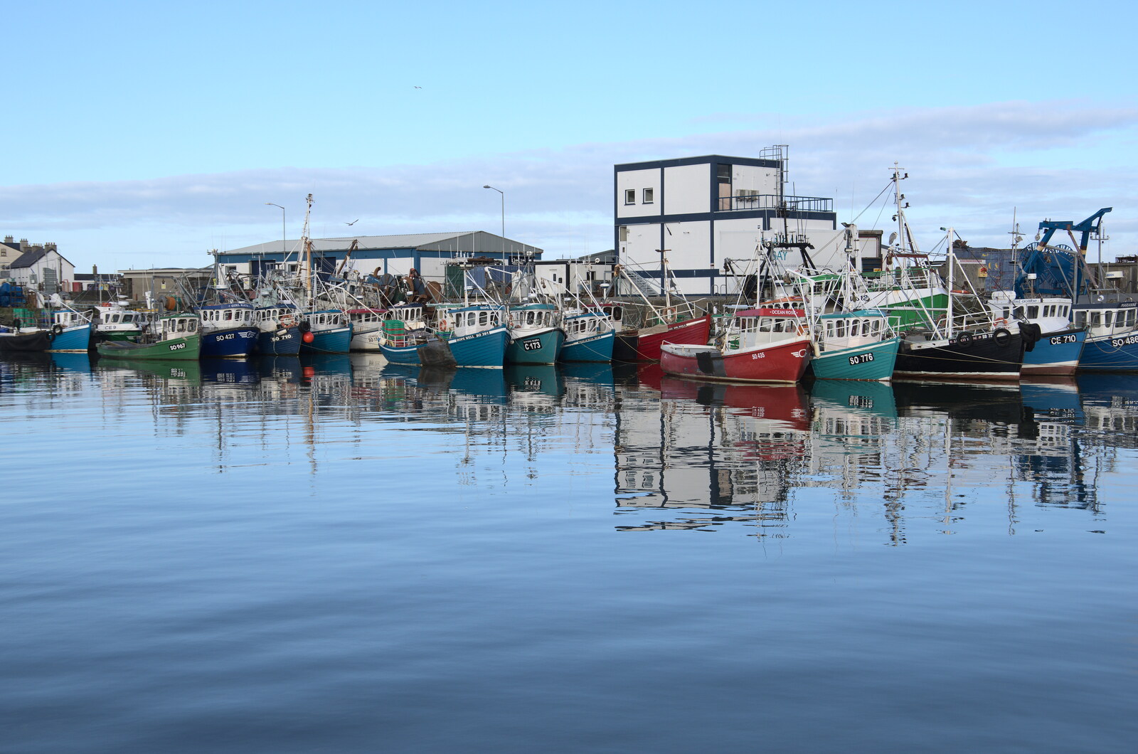Greencastle, Doagh and Malin Head, County Donegal, Ireland - 19th April 2022: Colourful fishing boats in the harbour