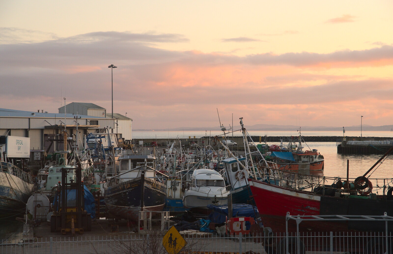 Greencastle, Doagh and Malin Head, County Donegal, Ireland - 19th April 2022: Sunset over Greencastle harbour