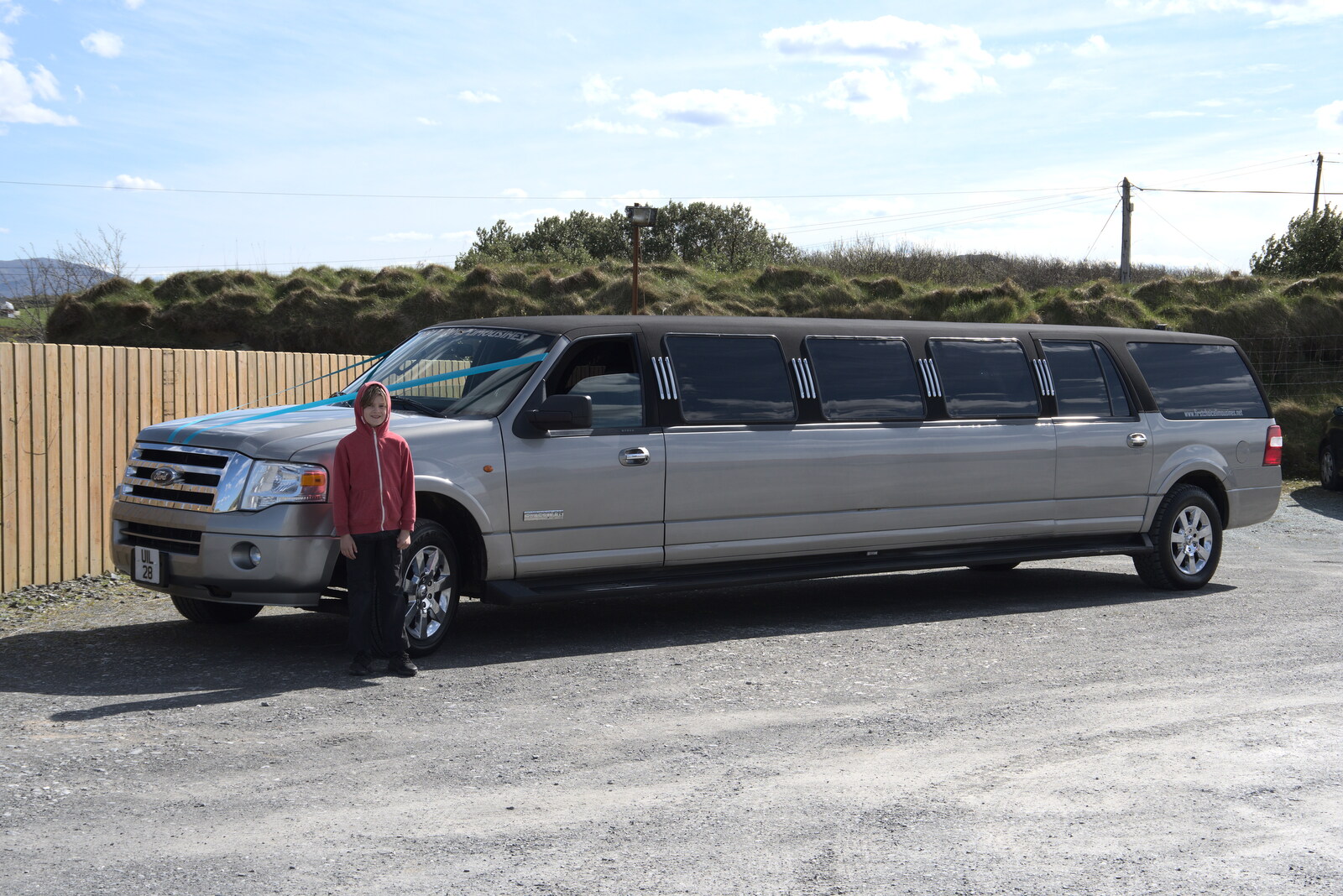 Greencastle, Doagh and Malin Head, County Donegal, Ireland - 19th April 2022: Harry stands next to the stretch limo