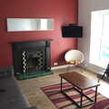 2022 The apartment's lounge has an original fireplace