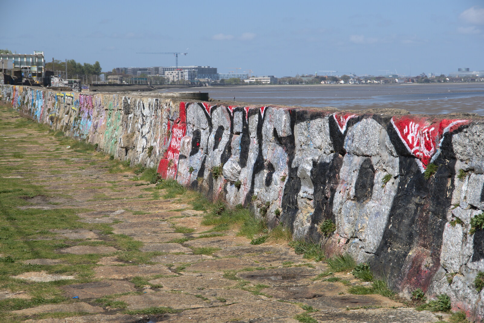Blackrock North and South, Louth and County Dublin, Ireland - 23rd April 2022: More tags on a sea wall by the DART