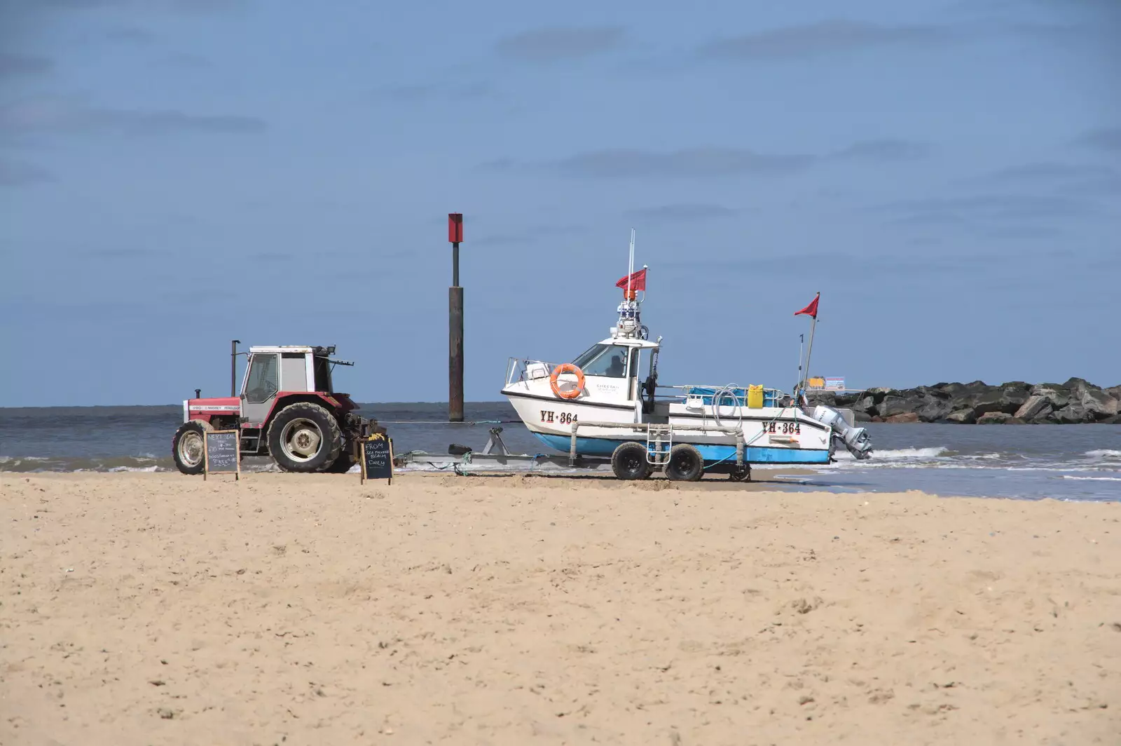 A tour boat and tractor wait on the beach, from On the Beach at Sea Palling, Norfolk - 8th May 2022