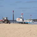 2022 A tour boat and tractor wait on the beach