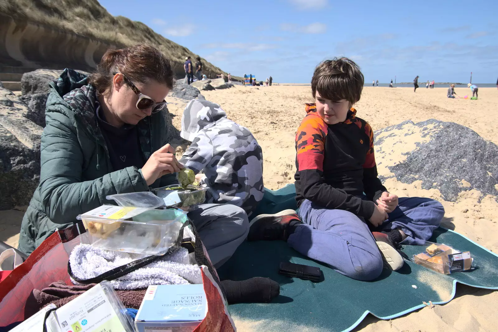 Isobel breaks out the M&S picnic products, from On the Beach at Sea Palling, Norfolk - 8th May 2022