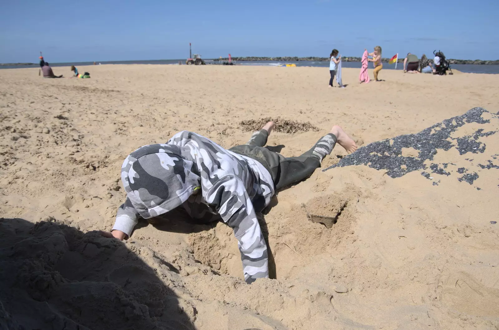 Harry digs a hole in the sand, from On the Beach at Sea Palling, Norfolk - 8th May 2022