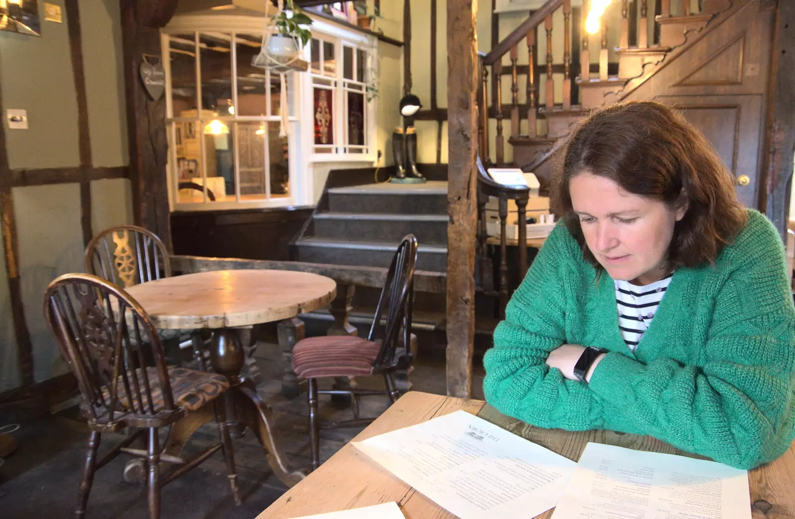 Isobel scopes out the menu in the Crown, from On the Beach at Sea Palling, Norfolk - 8th May 2022