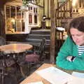 Isobel scopes out the menu in the Crown, On the Beach at Sea Palling, Norfolk - 8th May 2022