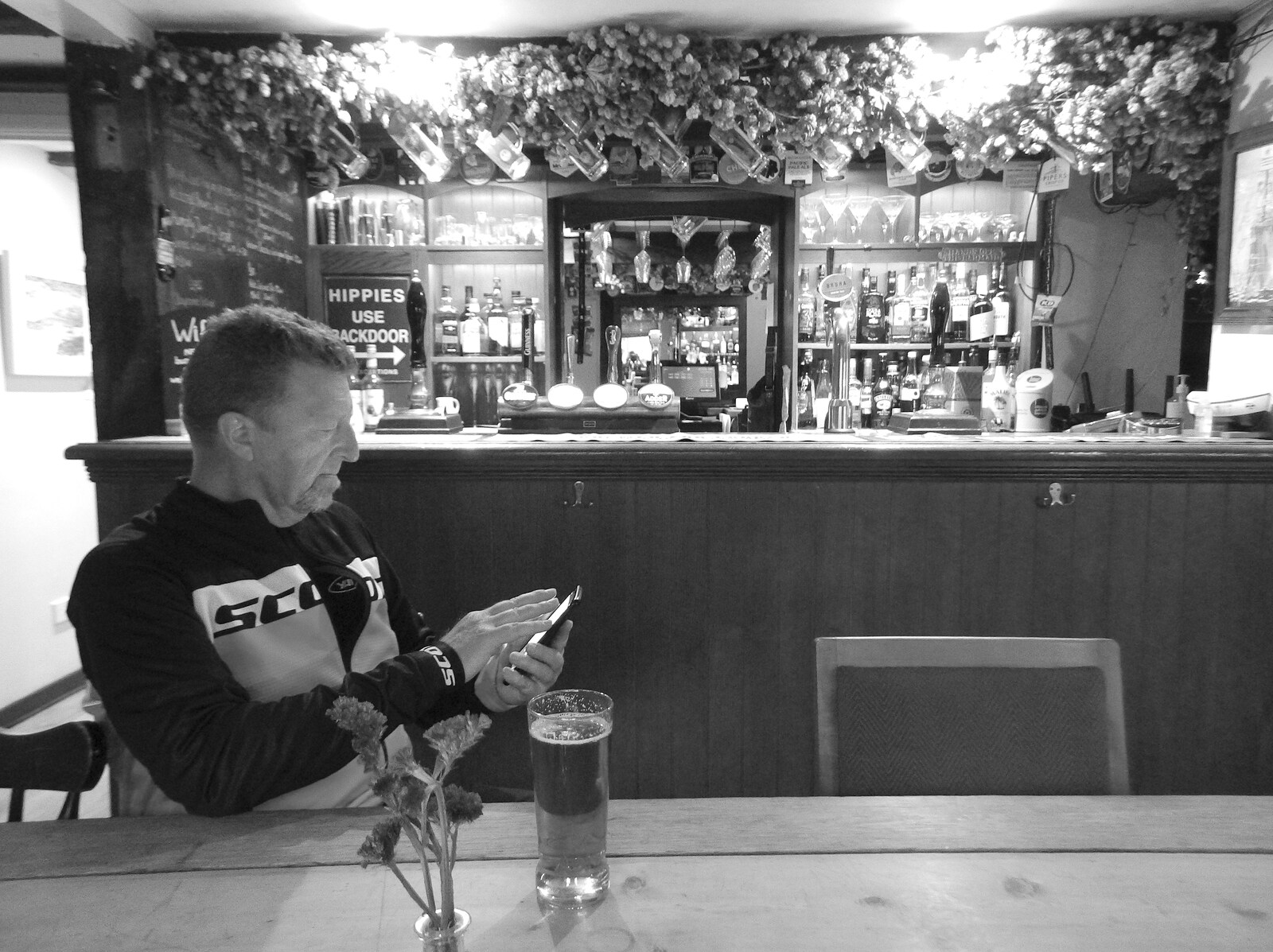 Gaz checks his phone in the Burston Crown from The BSCC at Burston and The Legend of Swallow Aquatics, East Harling, Norfolk - 15th May 2022