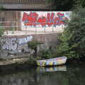 2022 A stripey boat is moored next to some graffiti