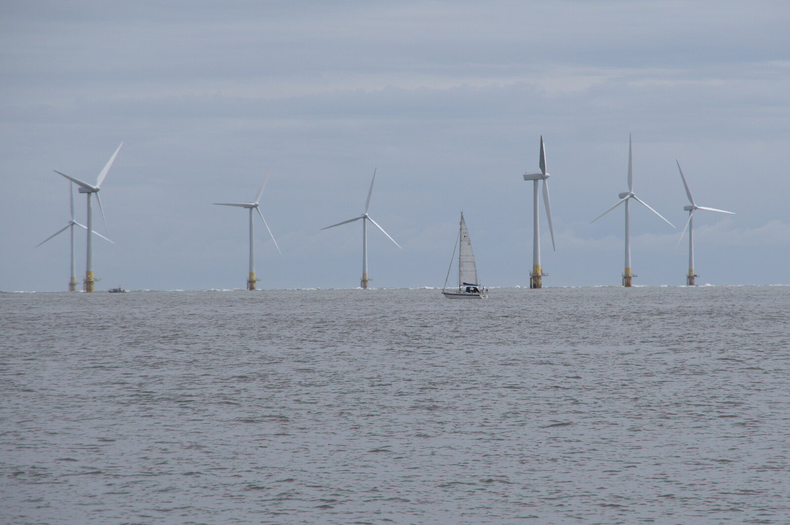 A boat sails past Scroby windfarm from Faded Seaside Glamour: A Weekend in Great Yarmouth, Norfolk - 29th May 2022