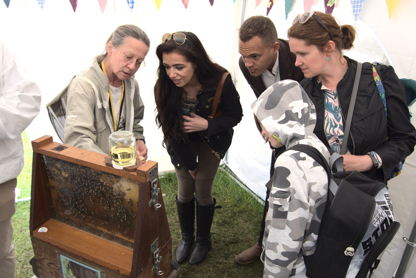 The Suffolk Show, Trinity Park, Ipswich - 1st June 2022: Harry and Isobel look at busy bees