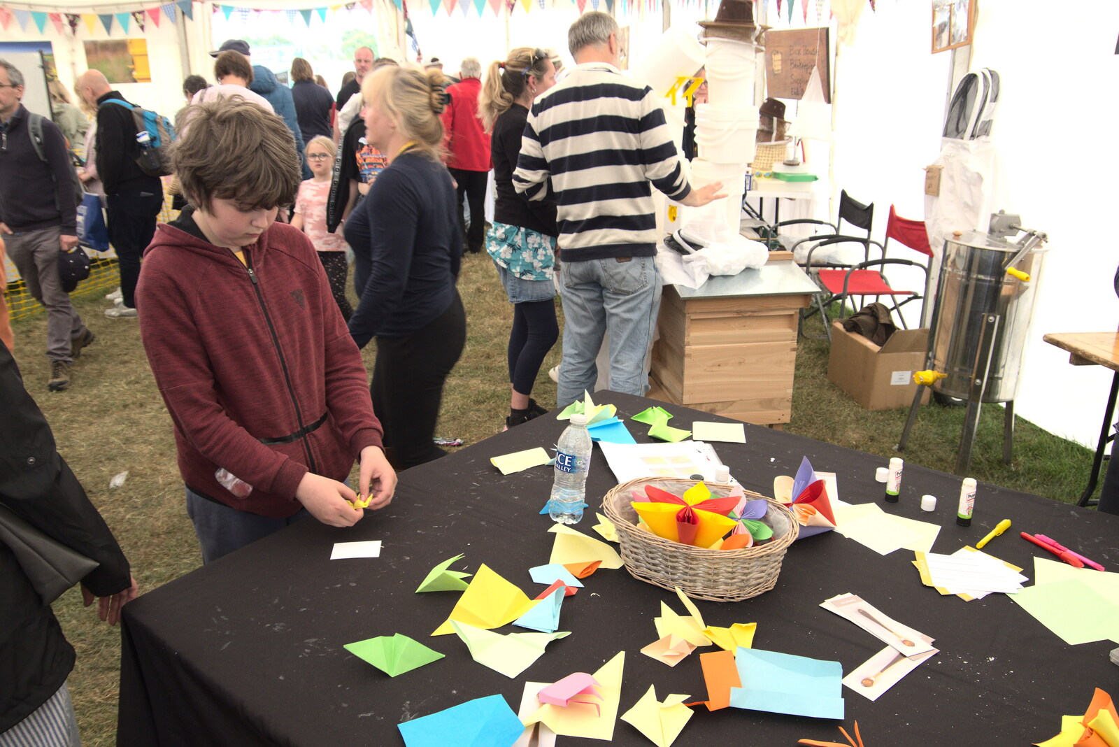 The Suffolk Show, Trinity Park, Ipswich - 1st June 2022: Fred does a quick origami flower
