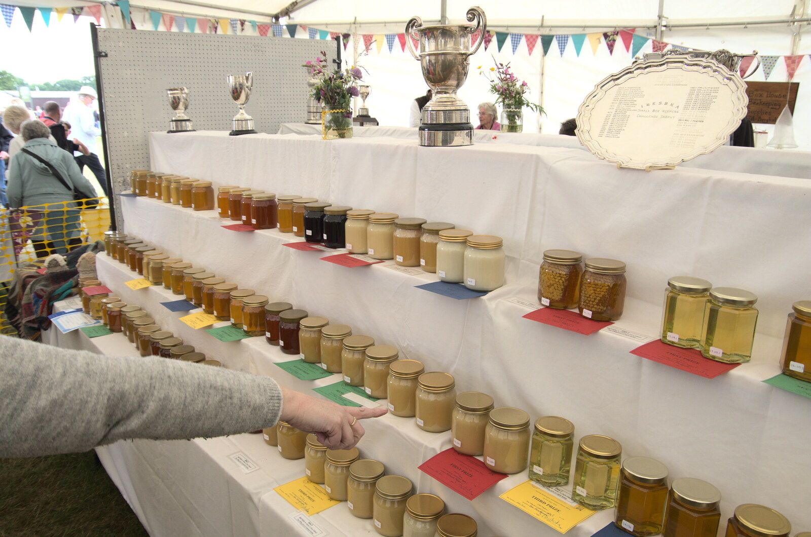 The Suffolk Show, Trinity Park, Ipswich - 1st June 2022: Someone points at honey