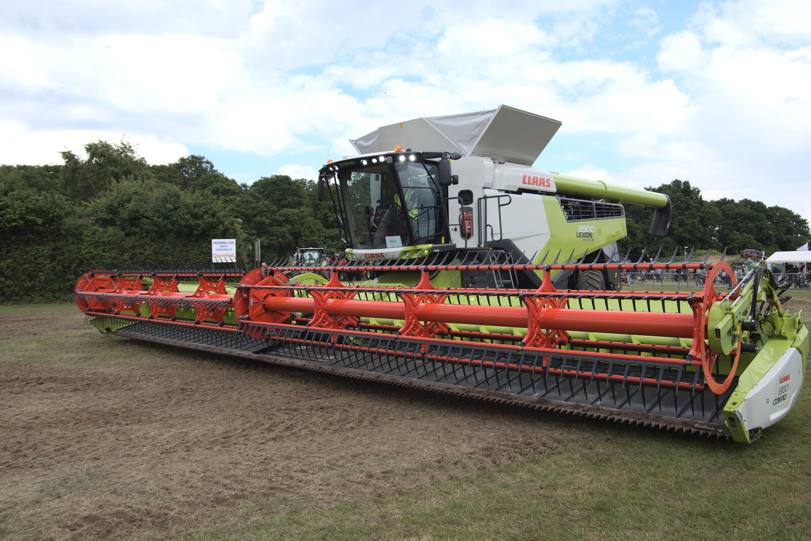The Suffolk Show, Trinity Park, Ipswich - 1st June 2022: A massive combine harvester does a demonstration