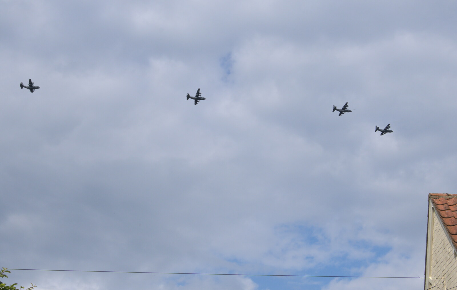 The Suffolk Show, Trinity Park, Ipswich - 1st June 2022: Four C-130 Hercules aircraft pass over the house