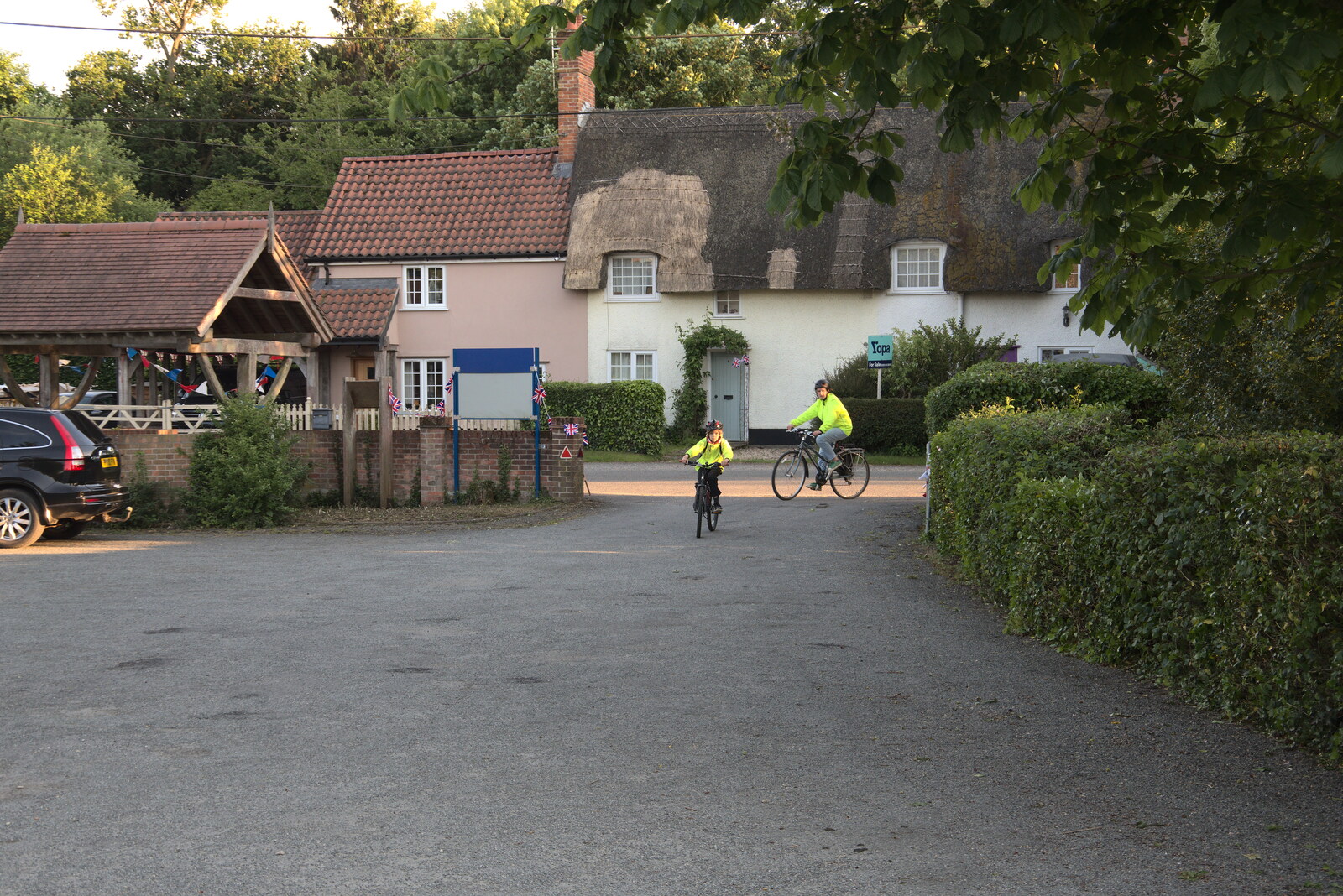Harry and Isobel cycle up to the village hall from The Gislingham Silver Band at Barningham, Suffolk - 3rd June 2022