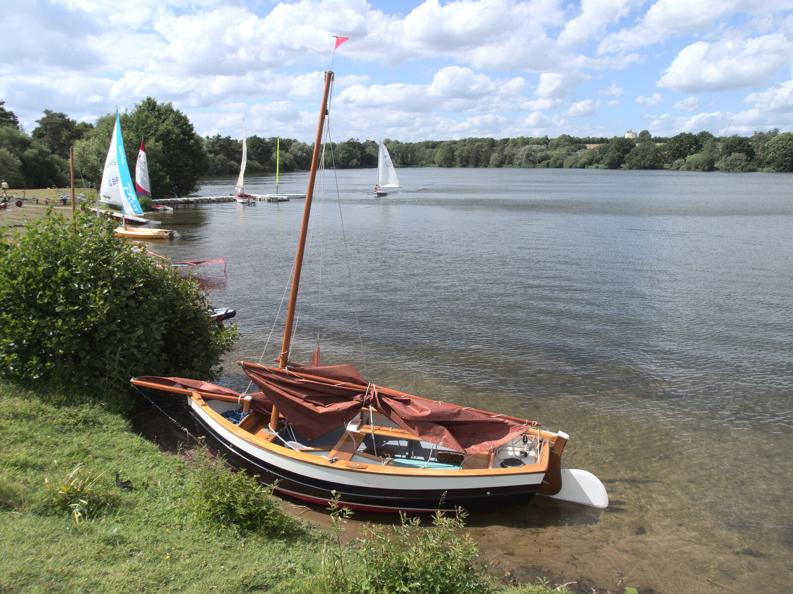 A Day at the Lake, Weybread Pits, Harleston, Norfolk - 11th June 2022: There's a lovely Gunter-rig wooden dinghie moored up