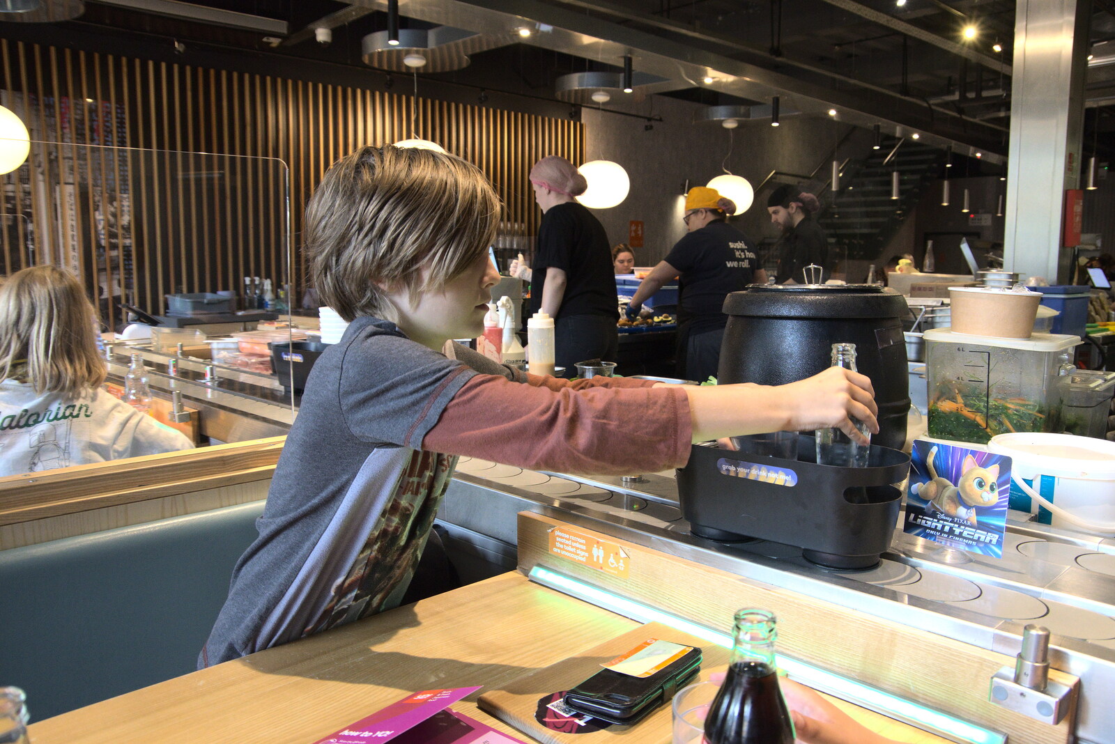 Lunch at Yo! Sushi, Norwich, Norfolk - 19th June 2022: Harry reaches out for the conveyor belt
