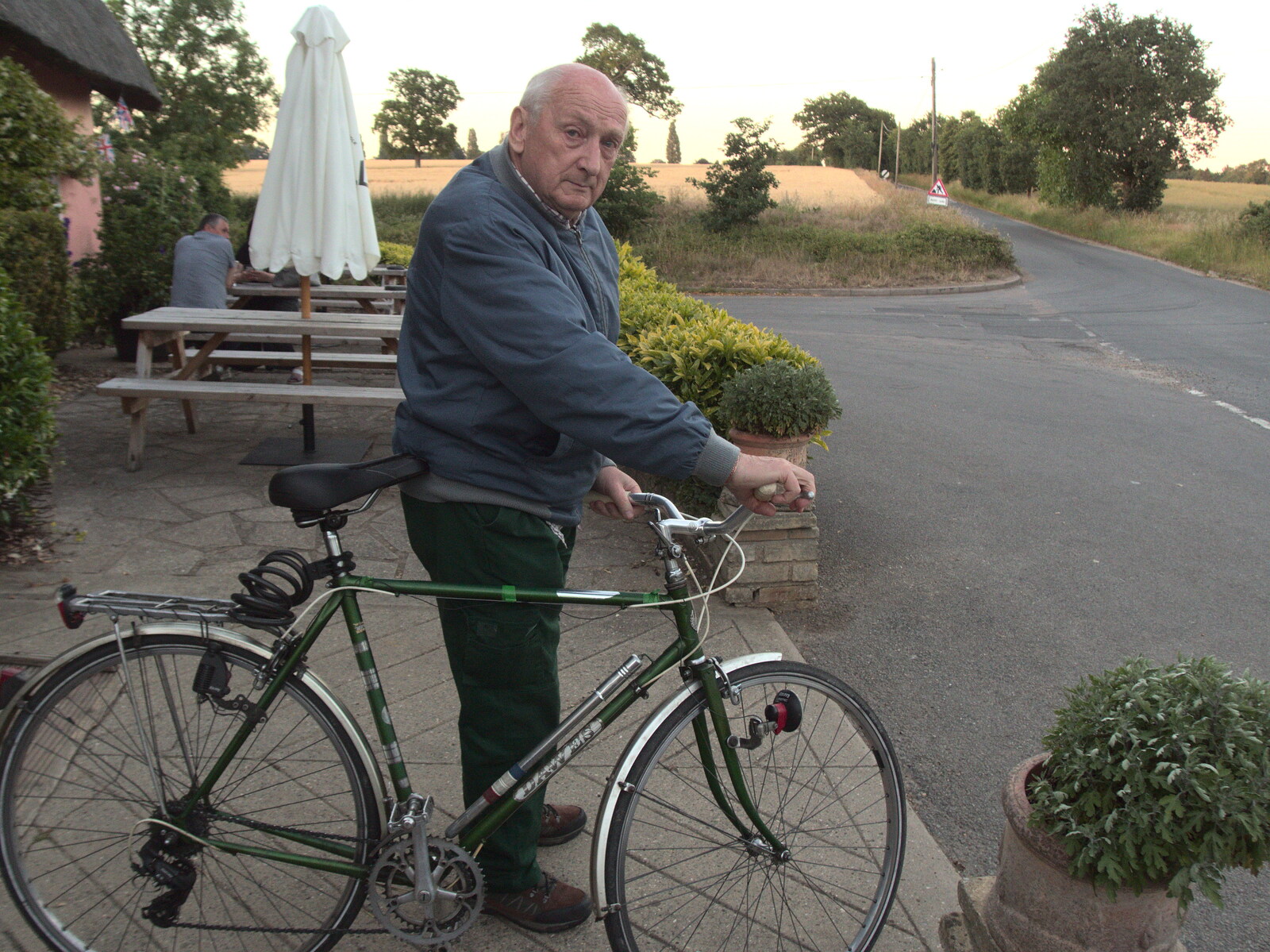 Mick 'gasses up the Hog' and heads off from Pizza at the Village Hall, Brome, Suffolk - 24th June 2022