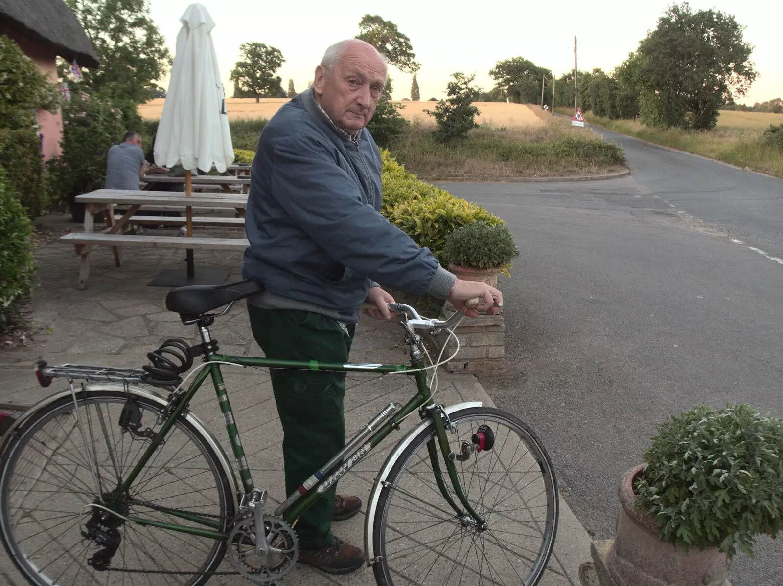 Mick 'gasses up the Hog' and heads off, from Pizza at the Village Hall, Brome, Suffolk - 24th June 2022