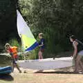 Harry helps launch a tiny dinghy, Camping at the Lake, Weybread, Harleston - 25th June 2022