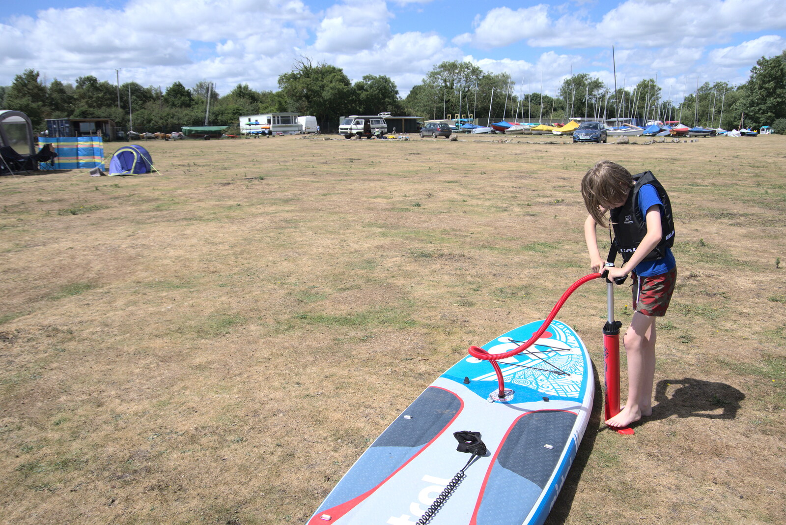Harry pumps up another paddle board from Camping at the Lake, Weybread, Harleston - 25th June 2022