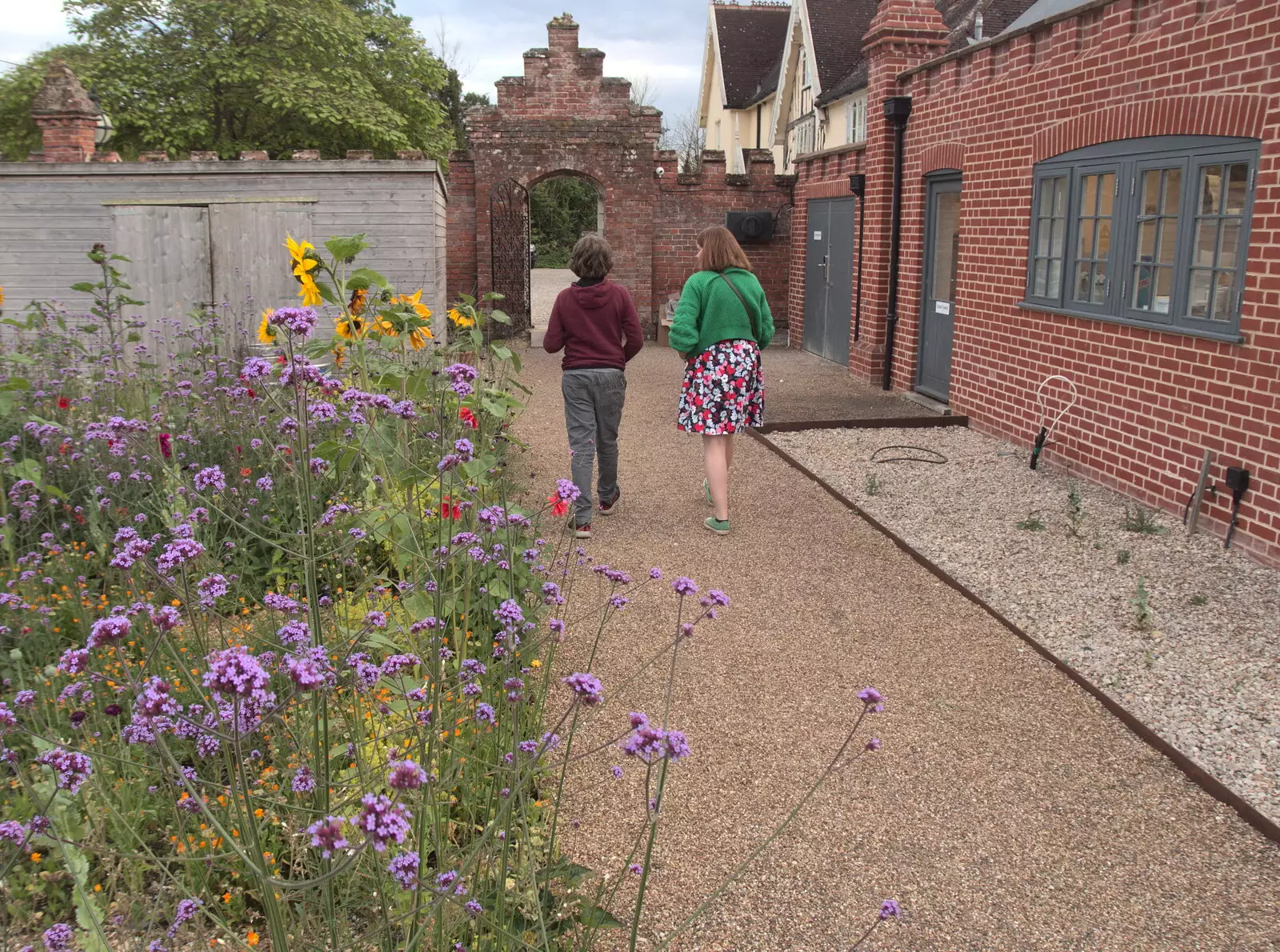 Fred and Isobel wander back to the bar, from A Fire, a Fête, and a Scout Camp, Hallowtree, Suffolk - 30th June 2022