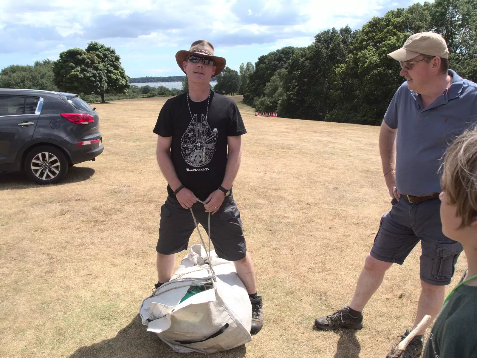 Andy P ties up another tent bag, from A Fire, a Fête, and a Scout Camp, Hallowtree, Suffolk - 30th June 2022