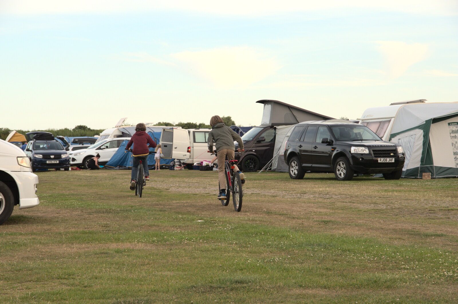 The boys head off on their bikes to the park from Camping in the Dunes, Waxham Sands, Norfolk - 9th July 2022