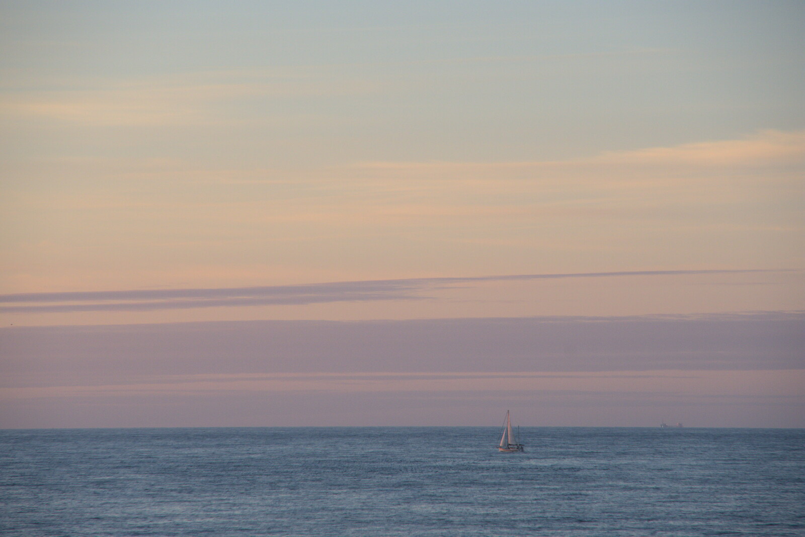 A sailing boat drifts by in the pastel sunset from Camping in the Dunes, Waxham Sands, Norfolk - 9th July 2022